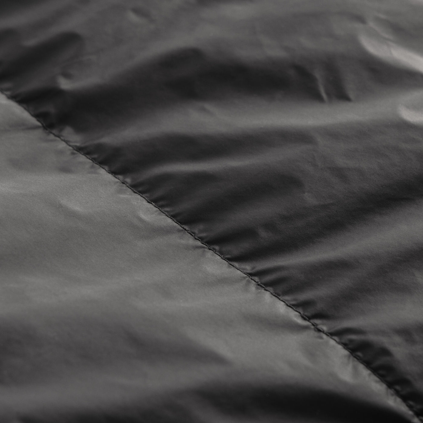 Close-up of 15D Nylon Taffeta fabric used in Zenbivy sleeping bags, showcasing smooth, durable shell material designed for lightweight camping and backpacking gear.