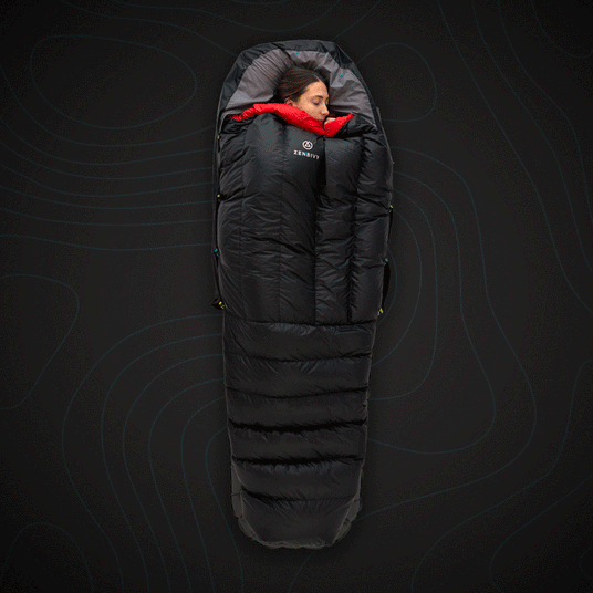 Zenbivy Core Quilt sleeping bag system with woman sleeping, showcasing spacious black and red camping quilt.