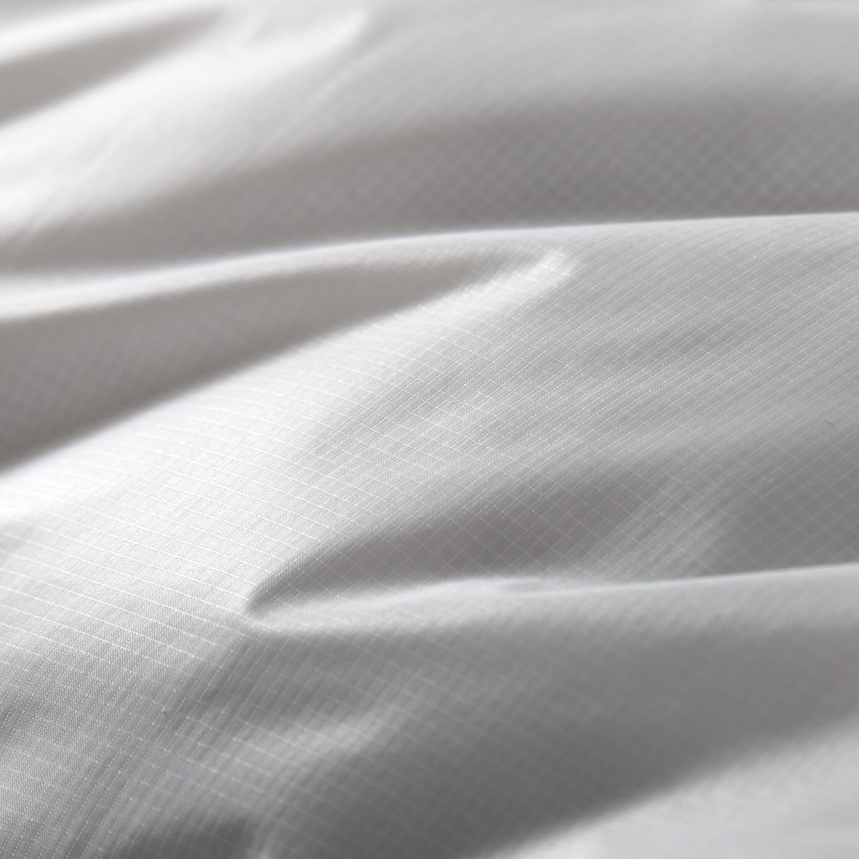 Close-up of Zenbivy Ultralight Bed's 10D Pertex® Quantum fabric, lightweight and soft backpacking quilt material designed for breathability and comfort.