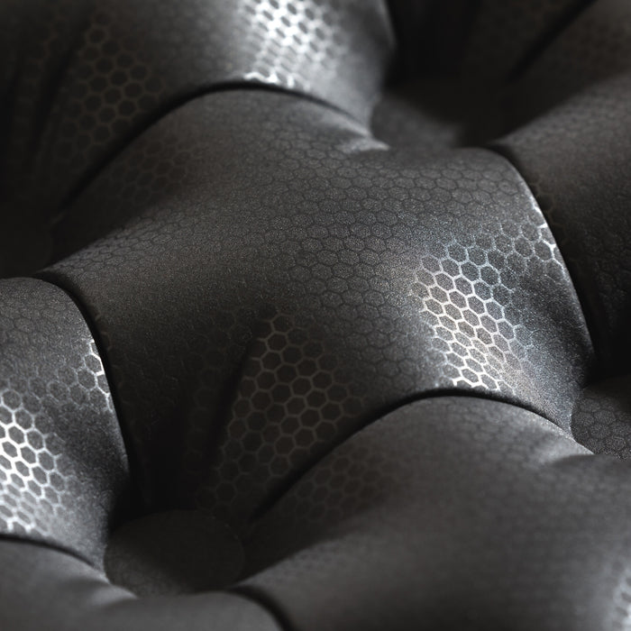 Detailed view of Zenbivy mattress with embossed 20D recycled polyester taffeta fabric. Hexagonal patterns visible on the laminated surface, emphasizing durability and strength of the material.