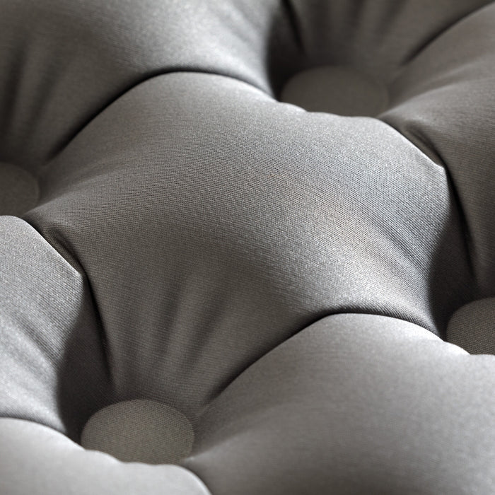 Close-up view of Zenbivy Flex™ mattress surface highlighting the exclusive 4-way stretch top fabric. The fabric forms soft, rounded indentations, showing its flexibility and ability to conform to the sleeper’s shape.