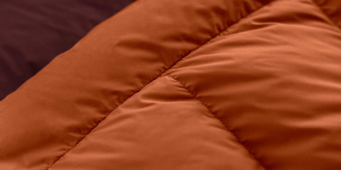 Close-up of soft 50D Polyester Pongee fabric used in Zenbivy sleeping bags, highlighting its smooth, luxurious texture designed for camping comfort.