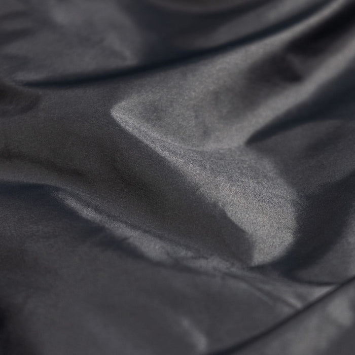 Close-up of Zenbivy Nylon Taffeta shell fabric, available in 15D and 20D, smooth and durable material used in camping quilts and sleeping bags.