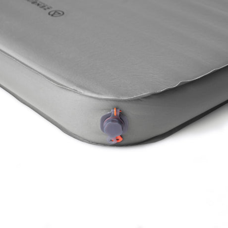 Detail shot of the Zenbivy Flex™ 3D Mattress corner, highlighting the flat top surface, vertical sidewalls, and air valve for at-home comfort feel.