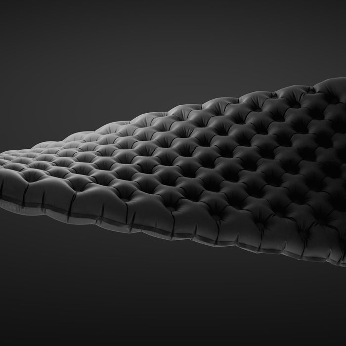 Close-up view of Zenbivy mattress showing offset air cell design, featuring diagonal baffle pattern for improved support and stability.