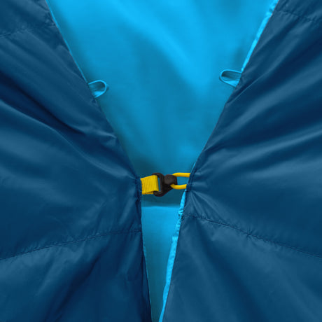 Close-up of Zenbivy Core Bed's yellow color-coded clip attachment, designed for secure, draft-free connection between quilt and sheet.