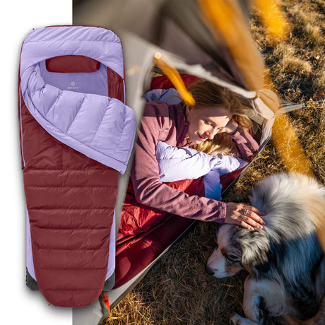 Woman relaxing with dog inside tent, using the Zenbivy ZipBed Trek system in purple, lightweight modular sleeping bag for camping comfort.